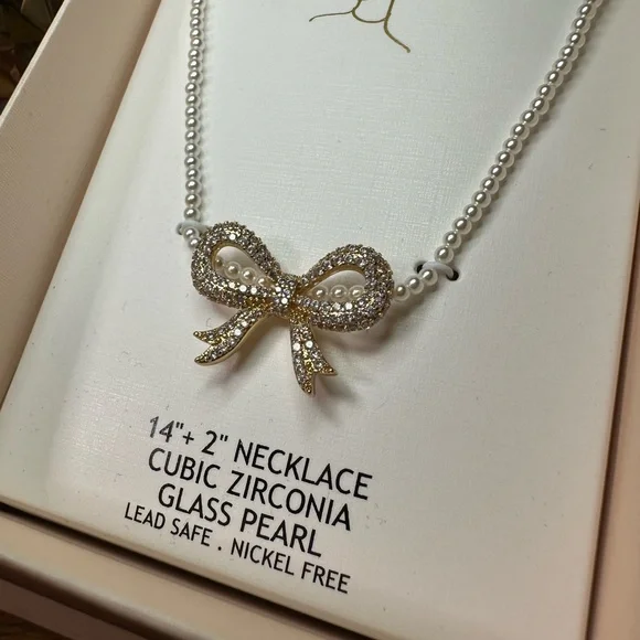 Camila Coelho Silver Cubic Zirconia Bow Necklace on strand of small faux pearls - Picture 6 of 10